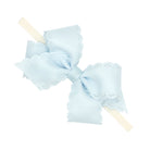 BLUE VAPOR - Small Grosgrain Hair Bow with Embossed Eyelet Edge on White Nylon Band from Anderson Parker