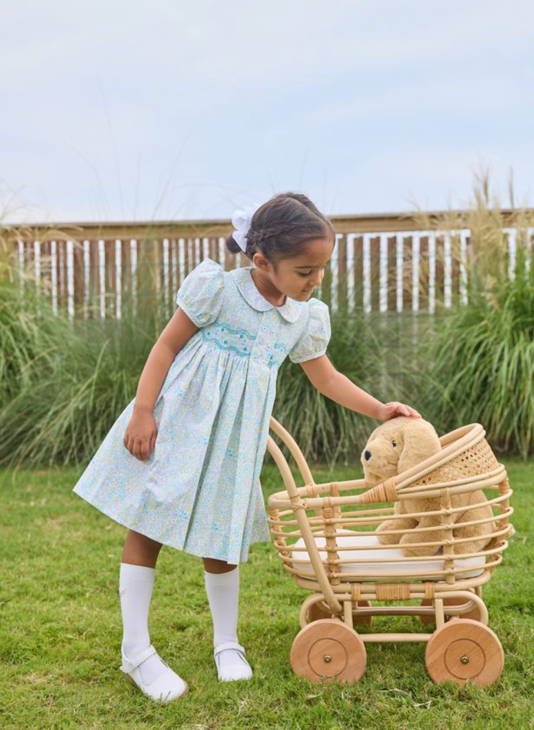 Child wearing a smocked Bridget dress in Briarcliff Floral print by Little English