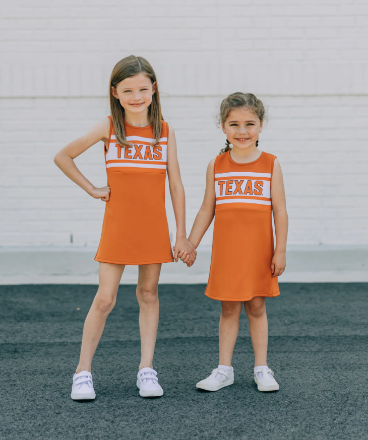 THE UNIVERSITY OF TEXAS BURNT ORANGE STRIPED CHEER DRESS from Anderson Parker