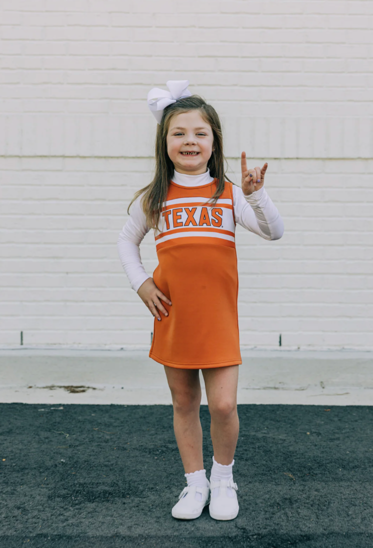 THE UNIVERSITY OF TEXAS BURNT ORANGE STRIPED CHEER DRESS from Anderson Parker